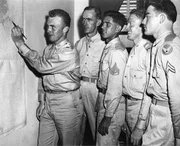 The crew looking at the map. The crew looking at the map.