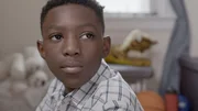 Close up of child Bryant (Caleb Sandridge).