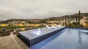 Full view of pool, with 4 wall infinity edge spa jets on, as seen in Pool Kings. Full view of pool, with 4 wall infinity edge spa jets on, as seen in Pool Kings.