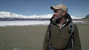 Close-up of Ed Stafford near frozen lake.