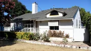 Exterior shot of the front house before renovation, as seen on Fix My Flip, Season Two.