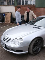 L-R: Elvis and Mike next to a Mercedes SL 55 AMG. L-R: Elvis and Mike next to a Mercedes SL 55 AMG.