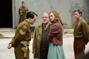 L-R: Sgt. Smythe (Harry Melling), Jack Friar (John Henshaw), Margaret (Freya Mavor), Bert Trautmann (David Kross)