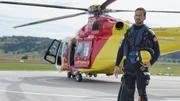 A rescuer standing by the helicopter in rescue gear. (National Geographic/Iona Feeder)