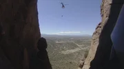 Hongbo Zhao waits to be lifted up into helicopter.