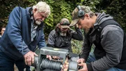Kayla Sheets, Paul Richardson, Ryan Cardoza and Fred Hurt check over the broken winch