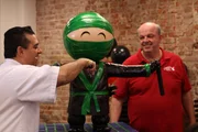 Buddy cuts into the ninja cake. Buddy cuts into the ninja cake.
