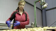 Christa Markut selecting the potatoes Christa Markut selecting the potatoes
