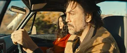L-R: Leo (Javier Bardem), Dolores (Salma Hayek)