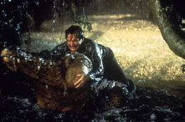 Ein Mann geht durch die gr&uuml;ne H&ouml;lle: Alan (Robin Williams) k&auml;mpft mit einem Krokodil ...