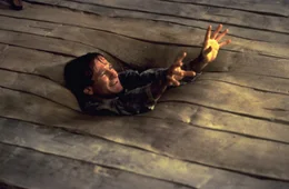 Schwierig, zu w&uuml;rfeln, wenn man gerade vom Fu&szlig;boden verschluckt wird: Alan (Robin Williams) in h&ouml;chster Not ...