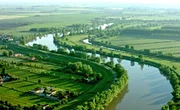 In gro&szlig;en Schleifen verl&auml;uft die Etsch durch die Po-Ebene, die von der Landwirtschaft gepr&auml;gt ist.