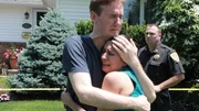 Eric and his sister grieve on the front lawn. Eric and his sister grieve on the front lawn.