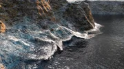 The Pacific Ocean is seen draining off the walls of the Kaikoura Canyon. The canyon lies just off the East Coast of New Zealand's South Island.