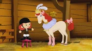 Tanja schmückt ein Pferd, das eine Balanciernummer auf einem Hochseil vorführen will. Tanja schmückt ein Pferd, das eine Balanciernummer auf einem Hochseil vorführen will.