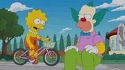 Lisa (l.) greift Krusty (r.) unter die Arme, da er mal wieder komplett pleite ist, w&auml;hrend Bart hofft, zum Schulausflug mitgenommen zu werden ...