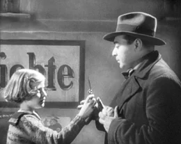 Der M&ouml;rder (Peter Lorre) und sein Opfer.