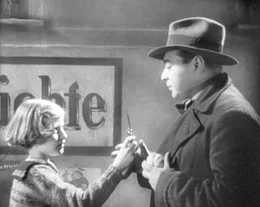 Der M&ouml;rder (Peter Lorre) und sein Opfer.