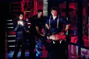 Picture shows L-R: Gwen (EVE MYLES), Toshiko (NAOKI MORI) and Capt. Jack (JOHN BARROWMAN) questioning Ianto, seated (GARETH DAVID-LLOYD) in the hub. EPISODE 4 'CYBERWOMAN' In the basement of the Torchwood building, Ianto Jones hides a terrible secret. As a Japanese doctor attempts to rescue the soul of a half-Cybernised woman, a quiet day in Torchwood quickly becomes a living nightmare. Has Ianto unleashed a force that will destroy his colleagues?