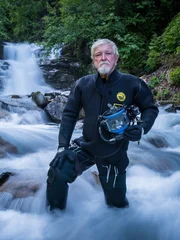 Fred Hurt stood in the creek before his first dive.