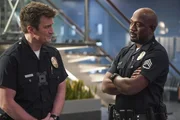 l-r: John Nolan (Nathan Fillion), Sergeant Wade Grey (Richard T. Jones)