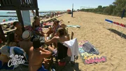 Tourists in the city of Caorle. "F&uuml;r immer Caorle"