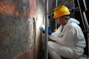 Gerardo Russo restores the remains of a fresco at the Domus Aurea, the 'Golden House' of Emperor Nero.