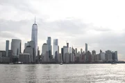 Lower Manhattan towers above the waters of the Hudson River. The World Trade Centre stands as the highest skyscraper.