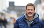 Moderator Jens H&uuml;bschen.