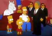 Bill Clinton (vorne re.) lobt Marge (hinten), Bart (li.), Lisa und Homer (Mi.) f&uuml;r ihre Tierliebe.