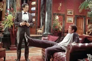 L-R: Emilio (John Turturro), Longfellow Deeds (Adam Sandler)
