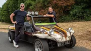 ANT ANSTEAD, wearing sunglasses, black T-shirt and jeans, leaning on the roll bar of the VW Buggy, with Duncan Cowper standing on the other side of the buggy, shot at Millbrook Proving Ground, trees in the background, after restoration, side view. ANT ANSTEAD, wearing sunglasses, black T-shirt and jeans, leaning on the roll bar of the VW Buggy, with Duncan Cowper standing on the other side of the buggy, shot at Millbrook Proving Ground, trees in the background, after restoration, side view.
