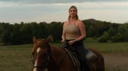 Heather A. rides a horse through farmland to her next destination, the southern battlefield. Heather A. rides a horse through farmland to her next destination, the southern battlefield.