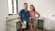 Stephanie Sitt and Luke Shantz pose in the kitchen, as seen on Betting on Paradise, Season 1.