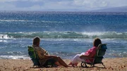 Clients Jim and Margie Boyce relax on the beach on Maui as seen on HGTV's Hawaii Life.
