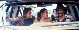 L-R:  Michael Douglas (Jack Colton)., Joan Wilder (Kathleen Turner), Juan (Alfonso Arau)
