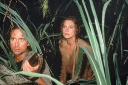 Michael Douglas (Jack Colton), Kathleen Turner (Joan Wilder).