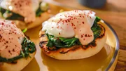 Beauty shot of Molly Yeh's Pita and Greens Benedict with Feta Cream, as seen on Girl Meets Farm, season 7. Beauty shot of Molly Yeh's Pita and Greens Benedict with Feta Cream, as seen on Girl Meets Farm, season 7.