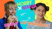 Segler Eddy tauscht sein Hobby mit Sacha, die Luftakrobatik macht.