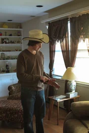 Recreation of Carl Isaacs playing with a gun holster he found in the Alday's home. Recreation of Carl Isaacs playing with a gun holster he found in the Alday's home.