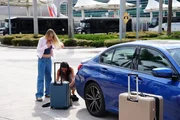 Elise Benson gets her bags out of the car at the airport. Elise Benson gets her bags out of the car at the airport.