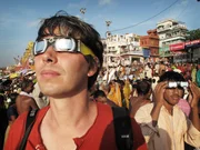 Prof. Brian Cox with solar filter glasses prior to the eclipse in Varanasi, India. Prof. Brian Cox with solar filter glasses prior to the eclipse in Varanasi, India.