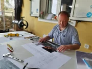 Simon Mills, owner of the HMHS Britannic wreck, looks at documents about the ship (National Geographic/Peter Mills)