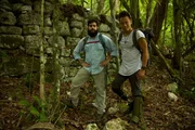 Macabilero, Guatemala - National Geographic Explorer Dr Albert Lin with Puerto Rican archaeologist Omar Alcover Firpi exploring the unique defensive walls of the ancient Maya citadel of Macabilero. Macabilero, Guatemala - National Geographic Explorer Dr Albert Lin with Puerto Rican archaeologist Omar Alcover Firpi exploring the unique defensive walls of the ancient Maya citadel of Macabilero.