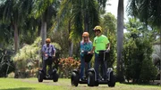 Home buyers Denise Norrisi (R) & Brian Norrisi (L) riding on segways as seen on Hawaii Hunters (action)