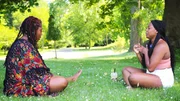 Ashley with her sister Sienna while sitting in the park while drinking a coffee. Ashley with her sister Sienna while sitting in the park while drinking a coffee.