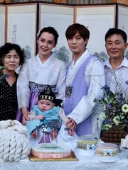 Deavan, Jihoon, and their family celebrate their baby’s 100th Day. Deavan, Jihoon, and their family celebrate their baby’s 100th Day.