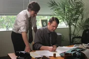 Neil and Stewart are in the office concerned about their accounting/embezzling. Neil and Stewart are in the office concerned about their accounting/embezzling.