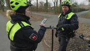 Judith and Andreas are checking the e-scooter Judith and Andreas are checking the e-scooter