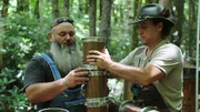 Jerry Benson and Mike Cockrell working on the aged whiskey still in the woods.